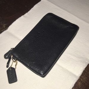 Coach black leather slightly used double sided wallet. Excellent shape!